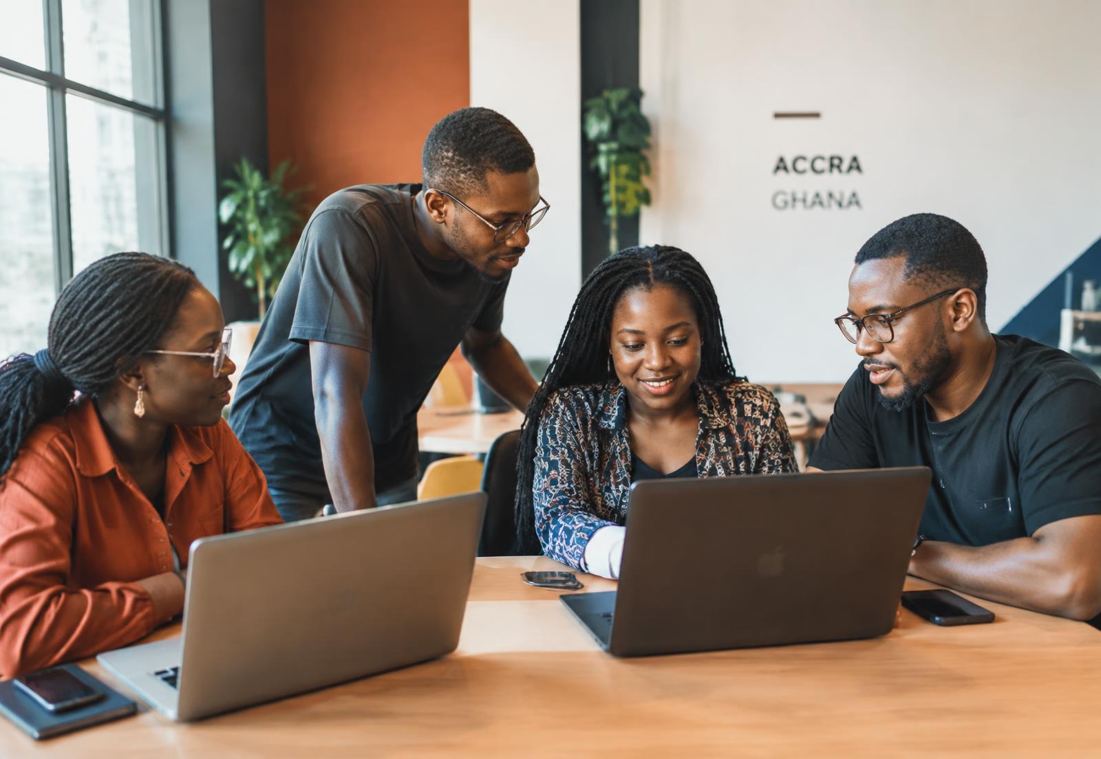 Young African professionals collaborating on AI projects